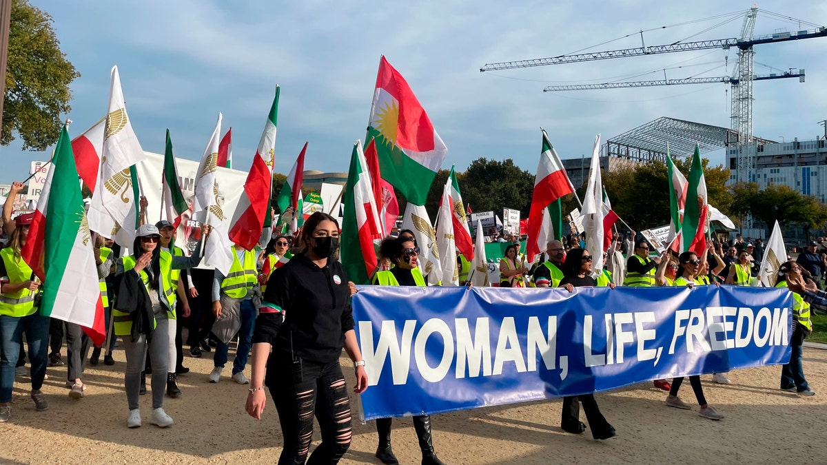 Mahsa Amini protestors with sign