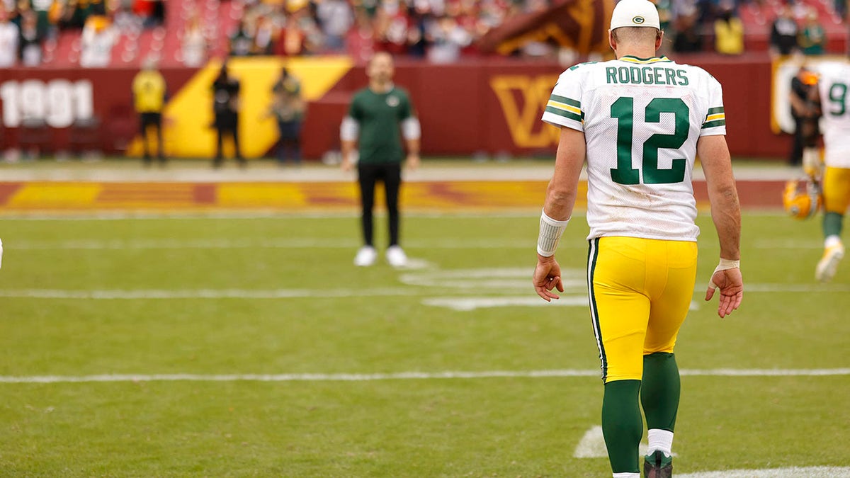 Aaron Rodgers walks off the field