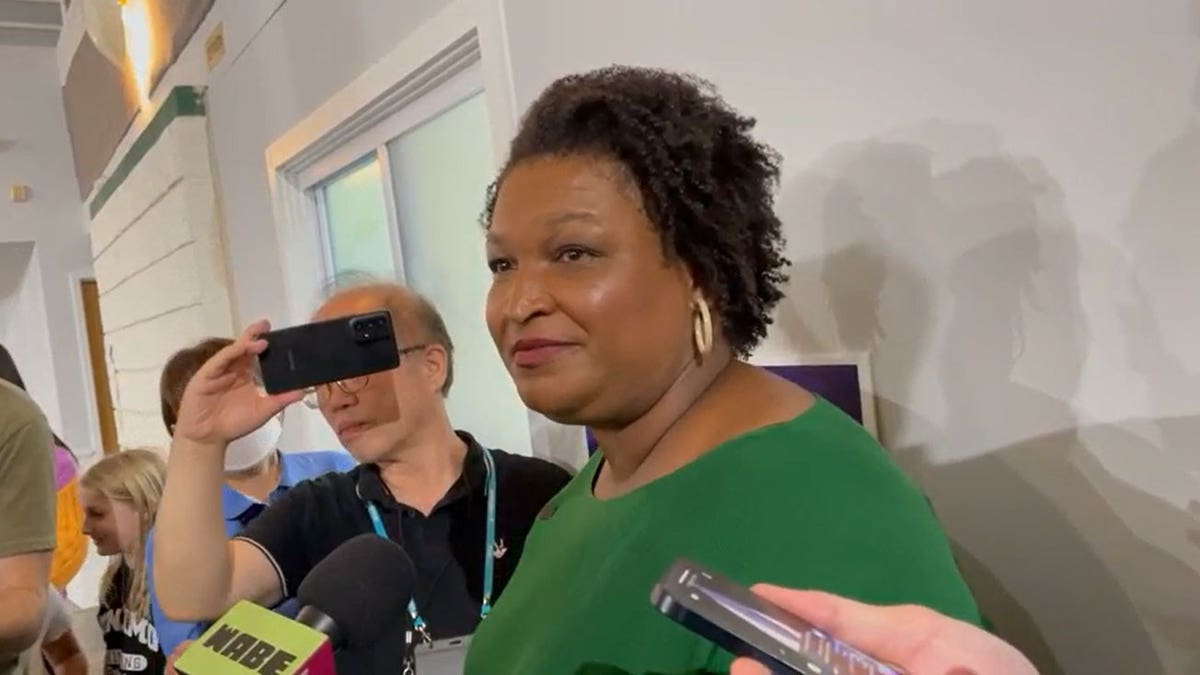 Stacey Abrams speaks to the media