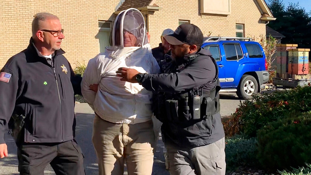 Rorie S. Woods being taken into custody by police 