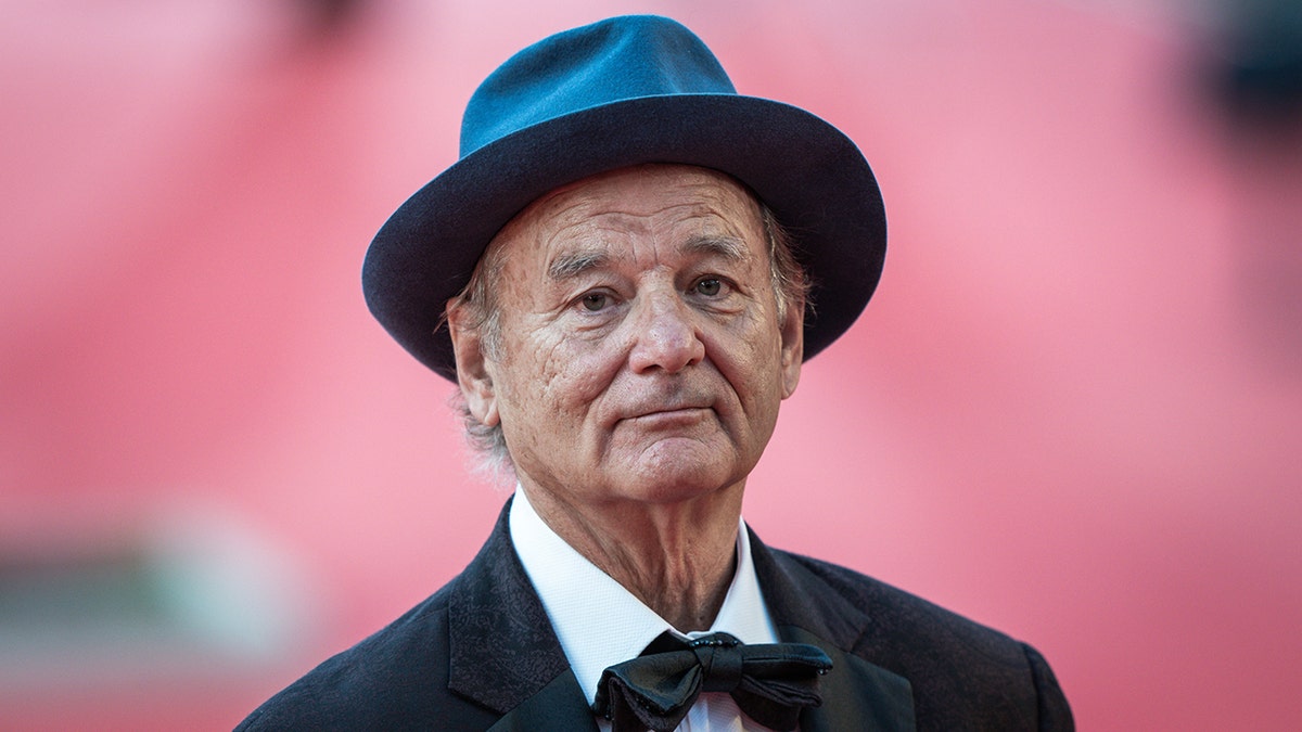 bill murray wears hat and bow tie on red carpet