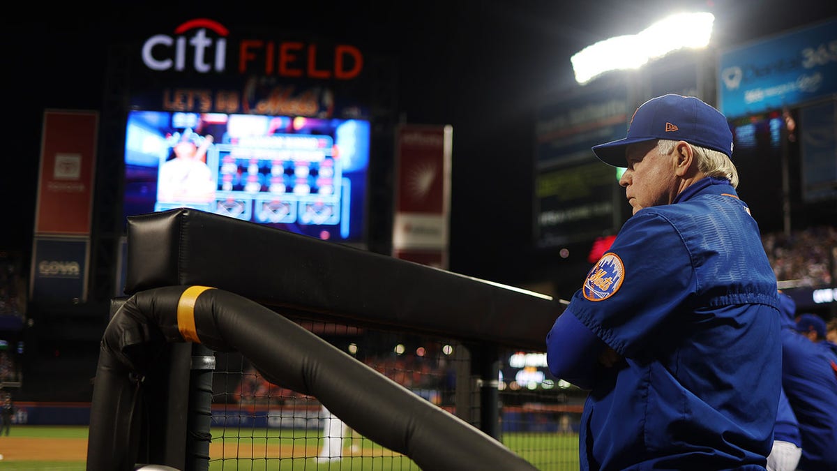 Manager Buck Showalter #11 of the New York Mets looks on from the dugout during the Wild Card Series game between the San Diego Padres and the New York Mets at Citi Field on Saturday, October 8, 2022 in New York, New York.