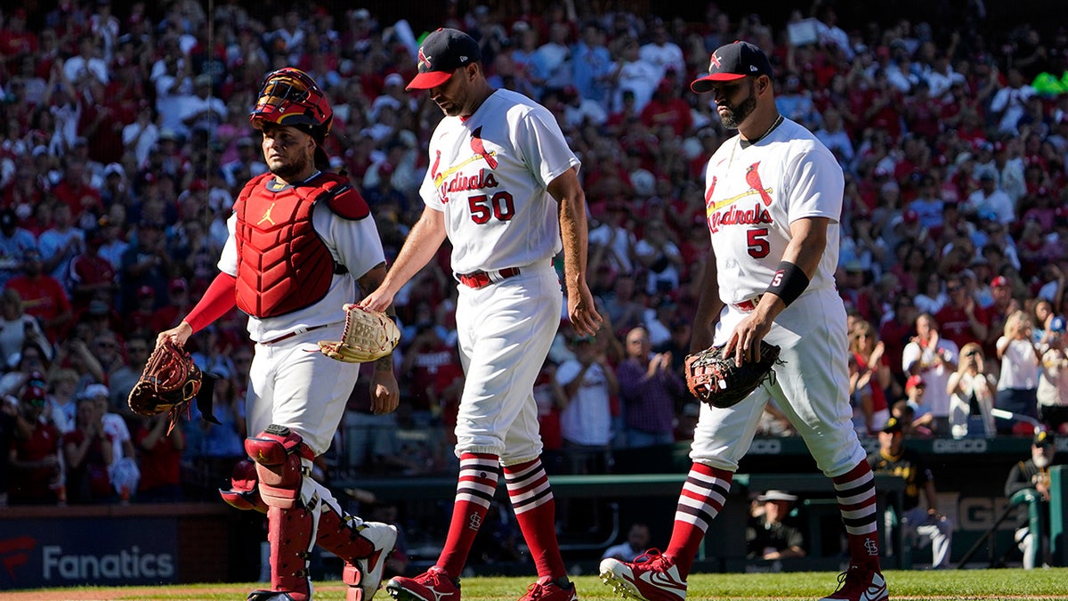 Cardinals players walk off the field