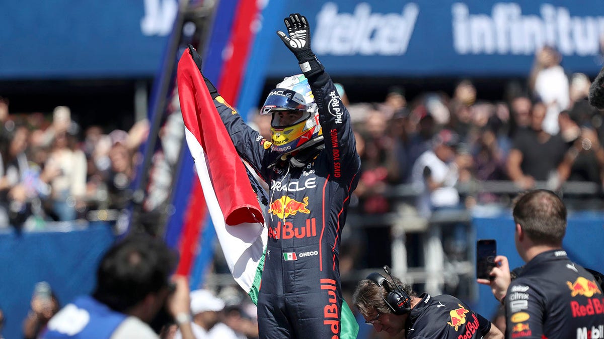 Red Bull driver waves at fans