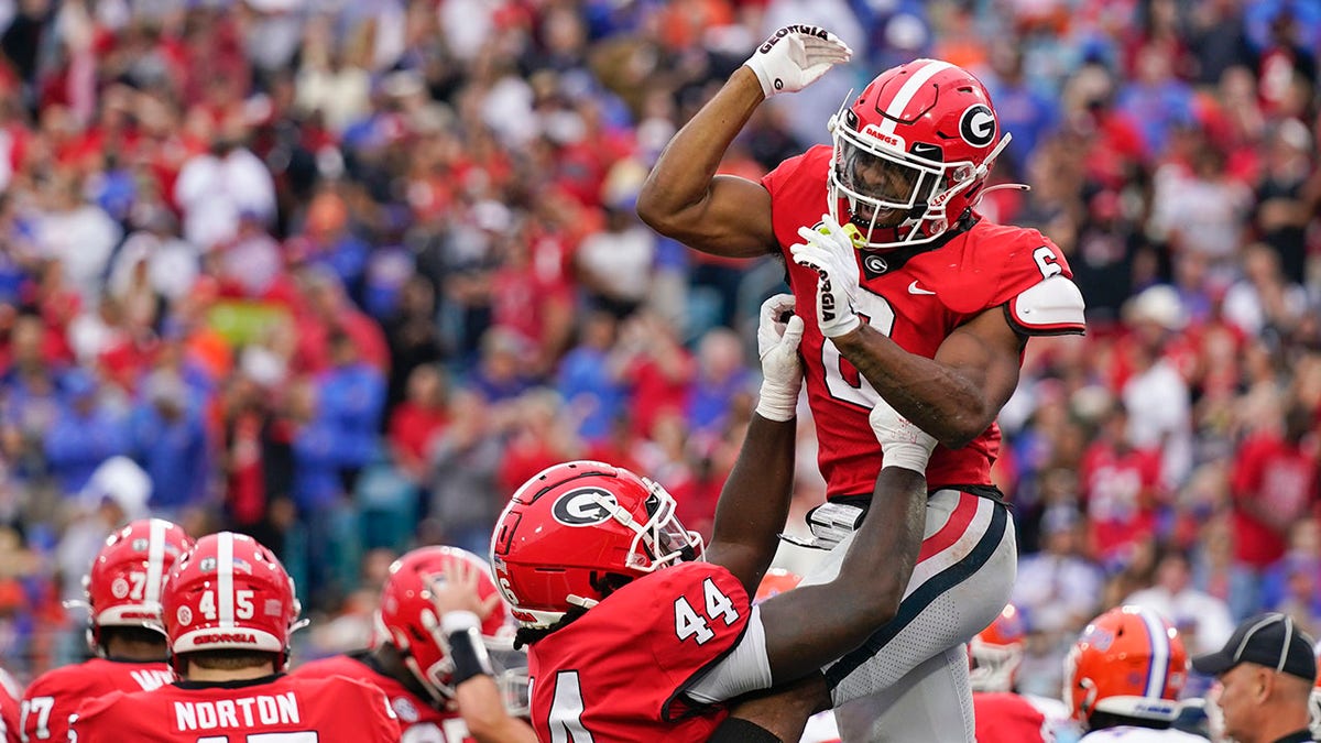 Georgia football players celebrate after a touchdown