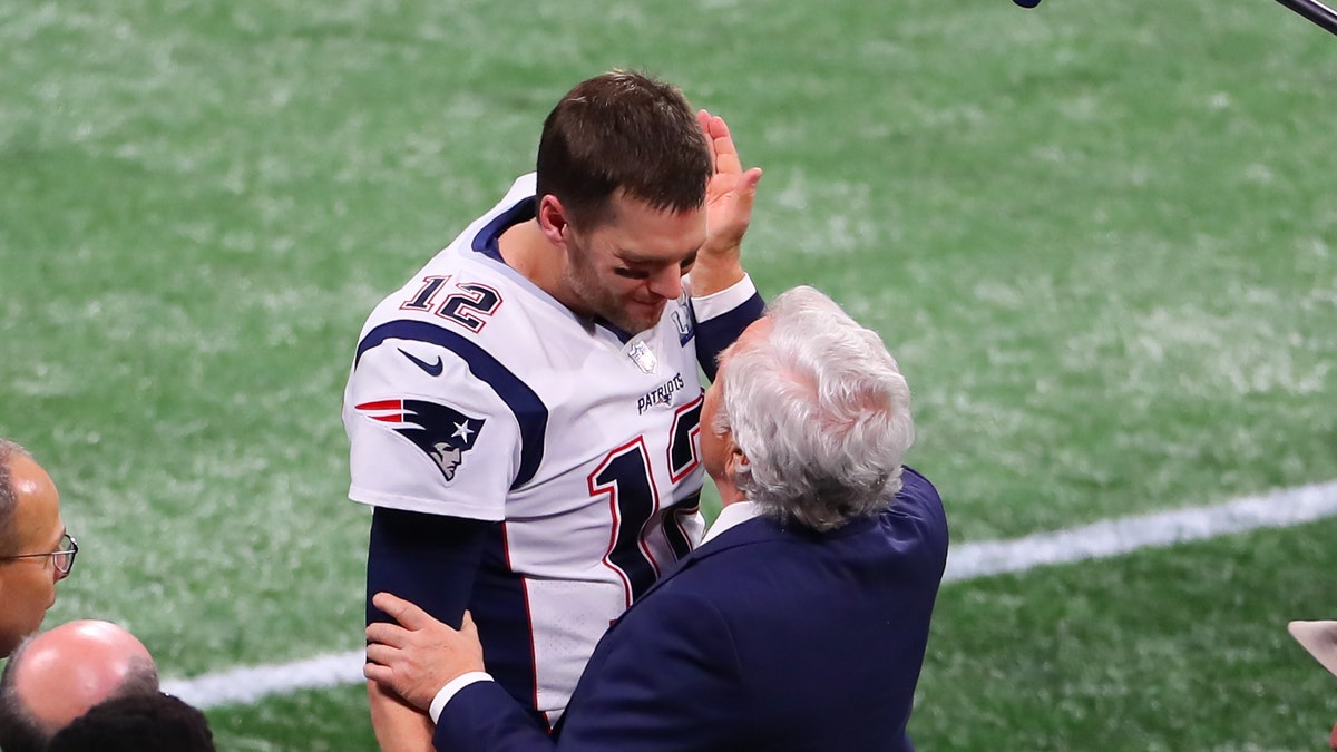 Robert Kraft embraces Tom Brady