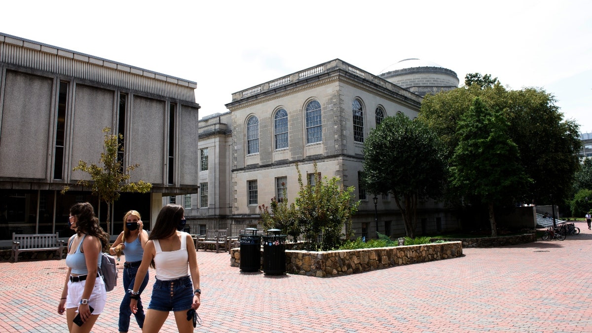 Students meander through the campus of the University of North Carolina at Chapel Hill