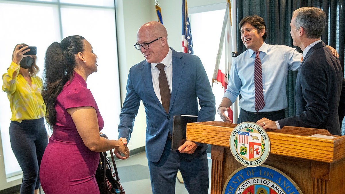 Nury Martinez shaking hands