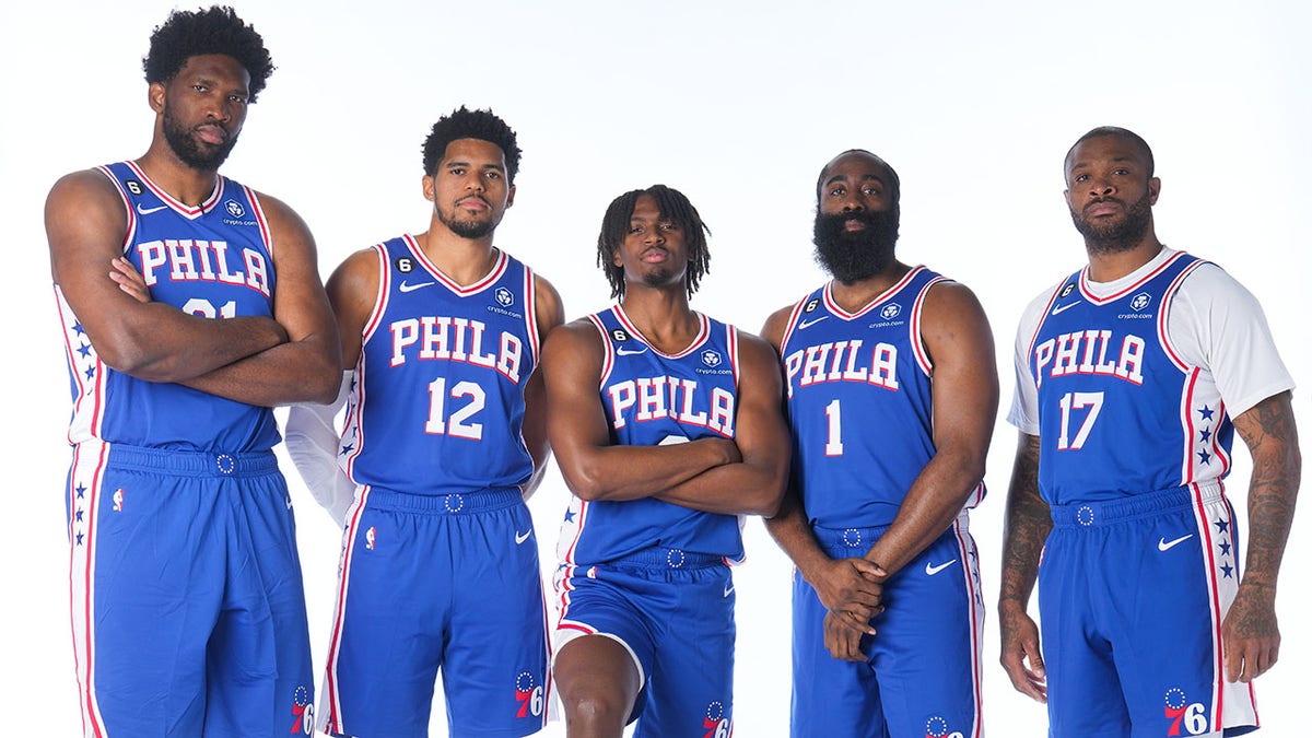 The Sixers starting five pose for a picture