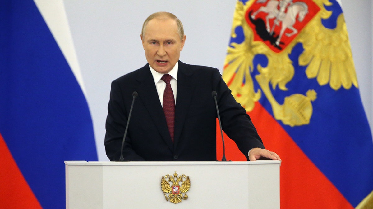 A photo of Vladimir Putin behind a podium