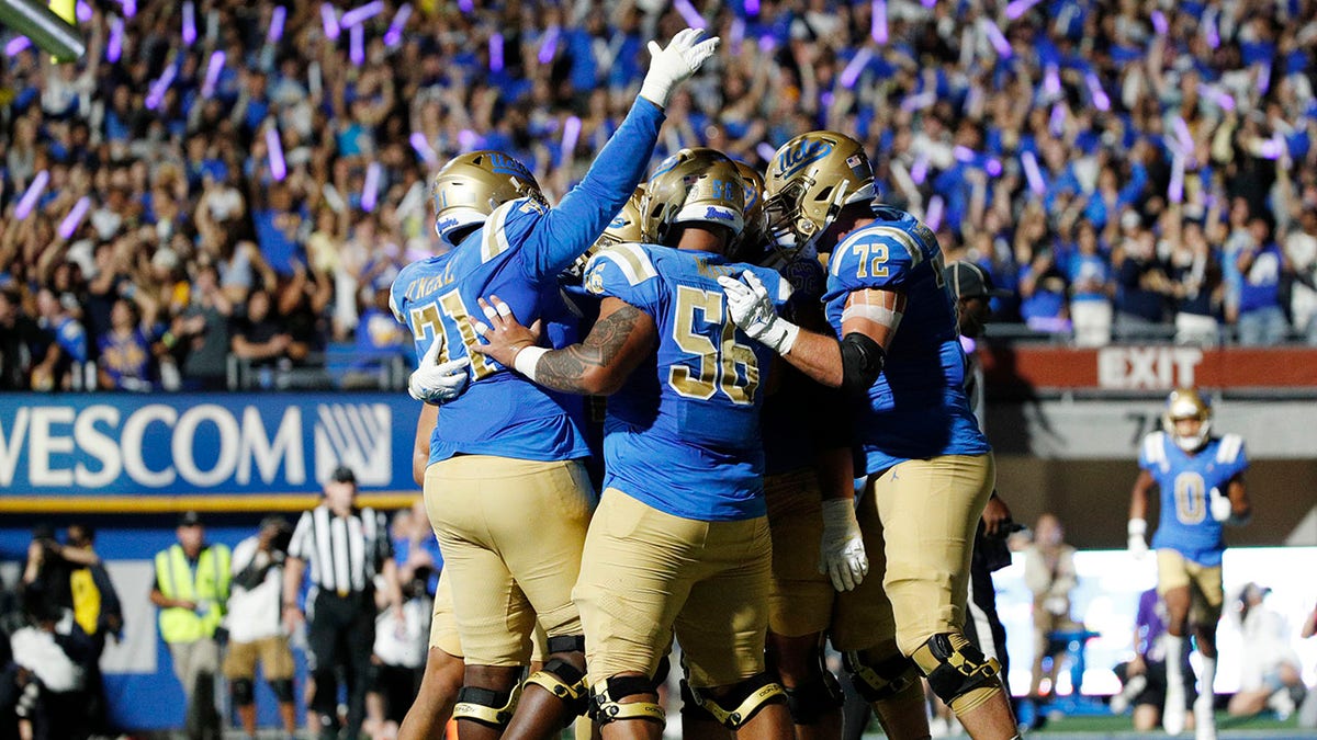 UCLA celebrates a touchdown against Washington