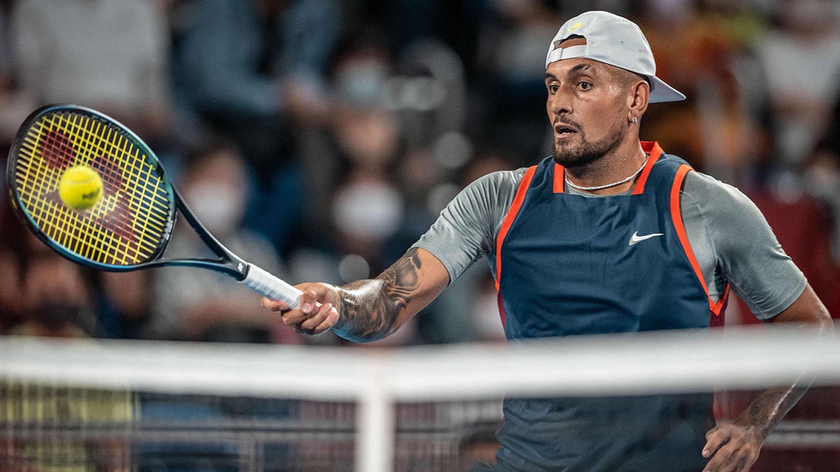 Nick Kyrgios returns a ball against Tseng Chun-hsin