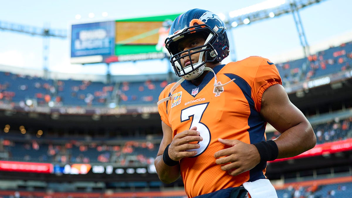 Russell Wilson warms up before Colts game