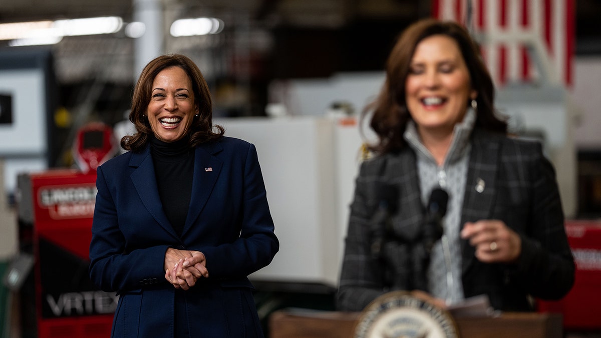 whitmer with harris in background at detroit event