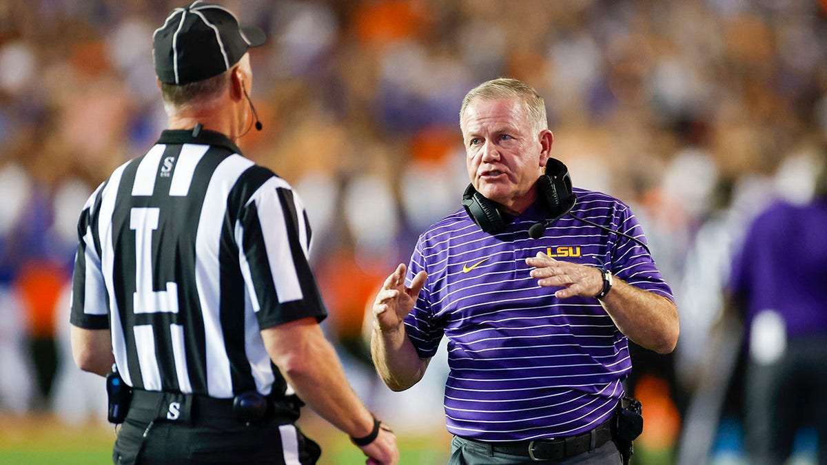 LSU Tigers head coach Brian Kelly argues a call