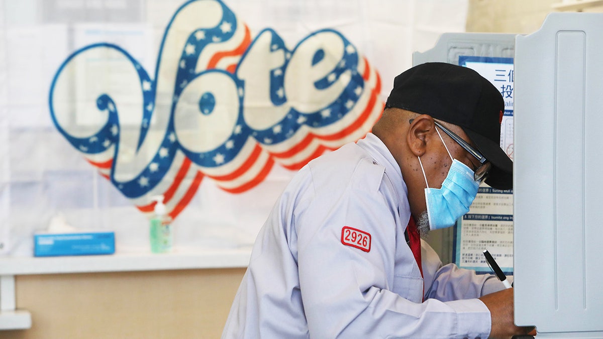 voter fills in ballot