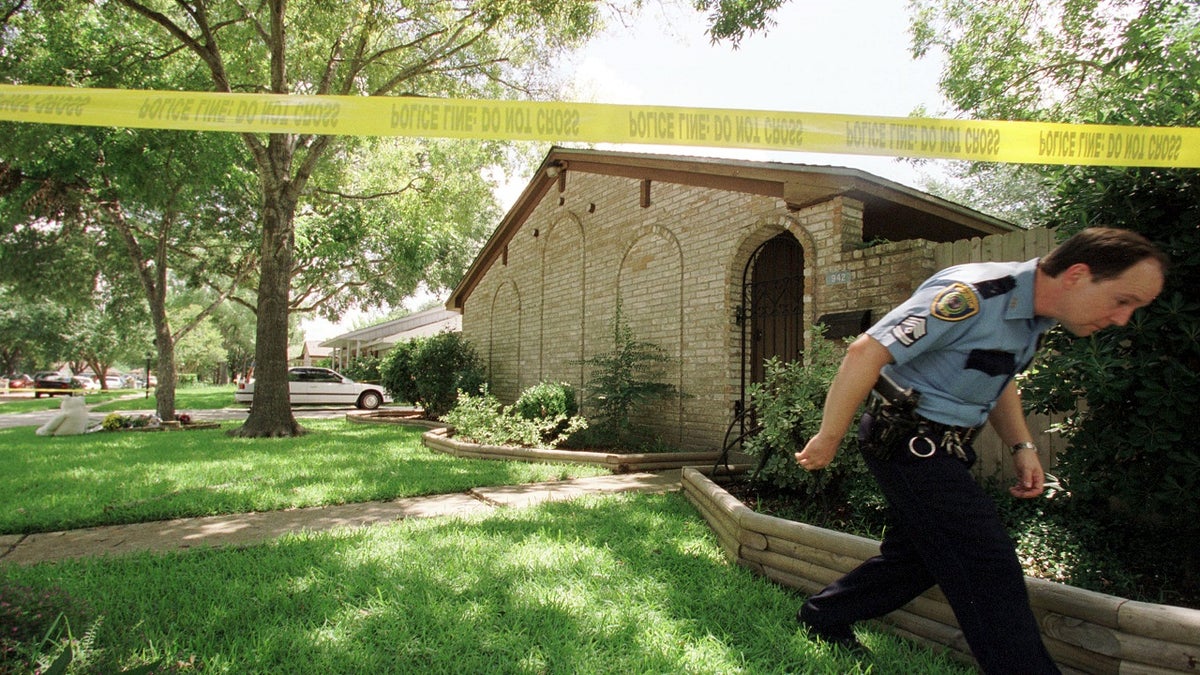 houston officer exiting crime scene