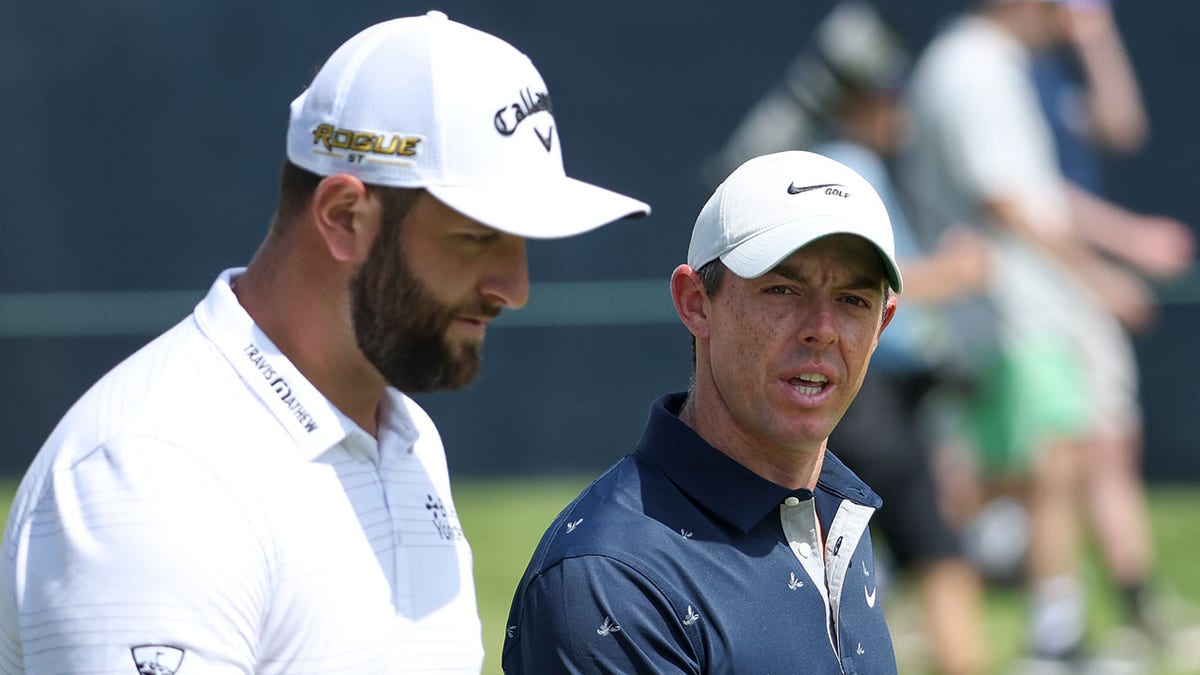 Jon Rahm and Rory McIlroy during a US Open practice round