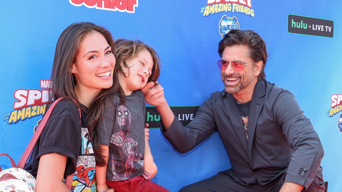 John Stamos with his wife Caitlin and son Billy
