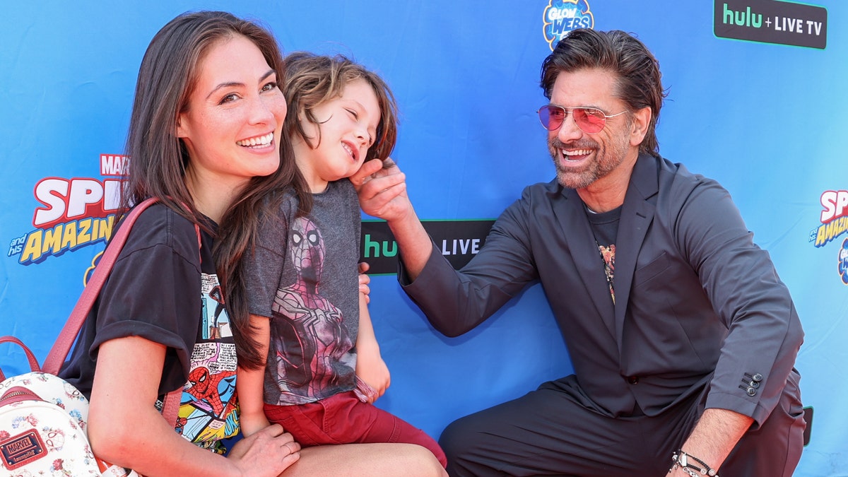 John Stamos with his wife Caitlin and son Billy