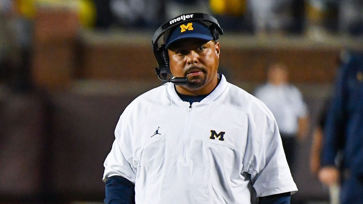 Blake Corum #2 (L) and Assistant Coach Mike Hart (R) of the Michigan Wolverines are seen during the second half of a college football game against the Hawaii Rainbow Warriors at Michigan Stadium on Sept. 10, 2022 in Ann Arbor, Michigan. The Michigan Wolverines won the game 56-10 over the Hawaii Rainbow Warriors.?