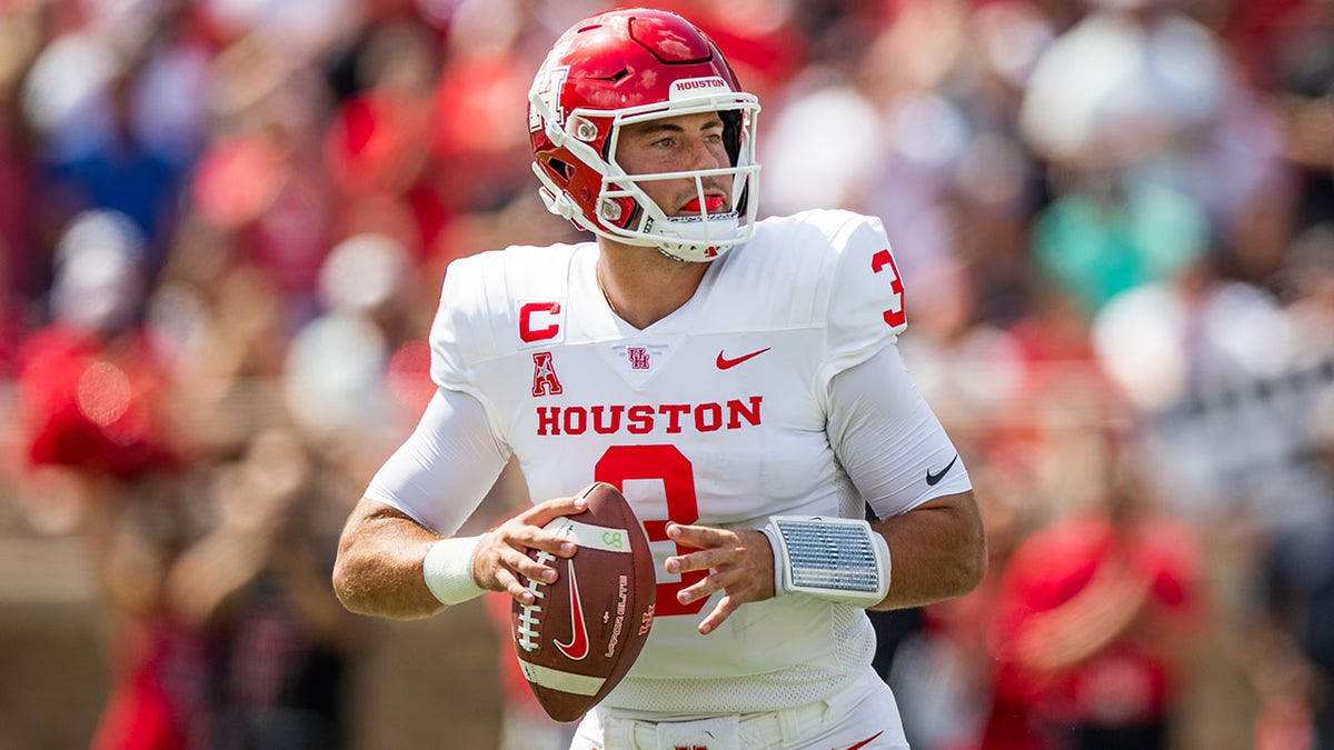 Quarterback Clayton Tune throws against Texas Tech