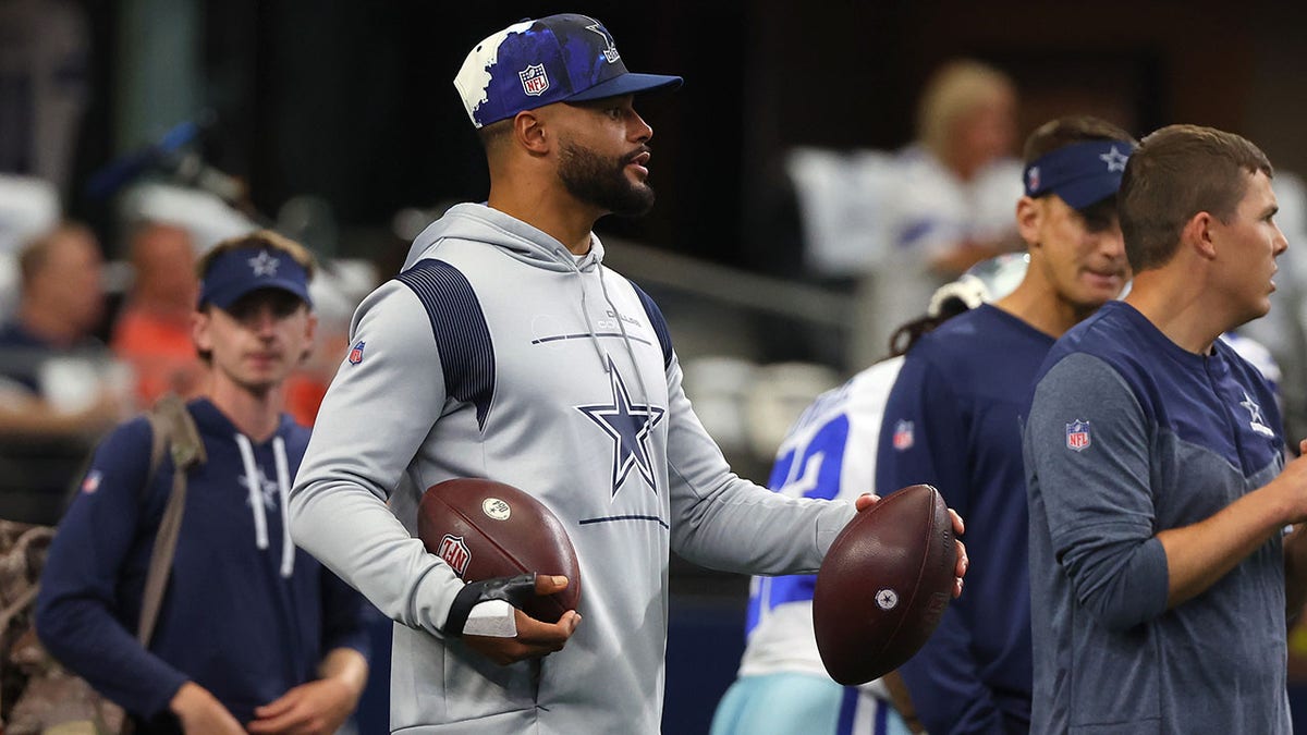 Dallas Cowboys quarterback Dan Prescott warms up before the NFL News  Photo - Getty Images