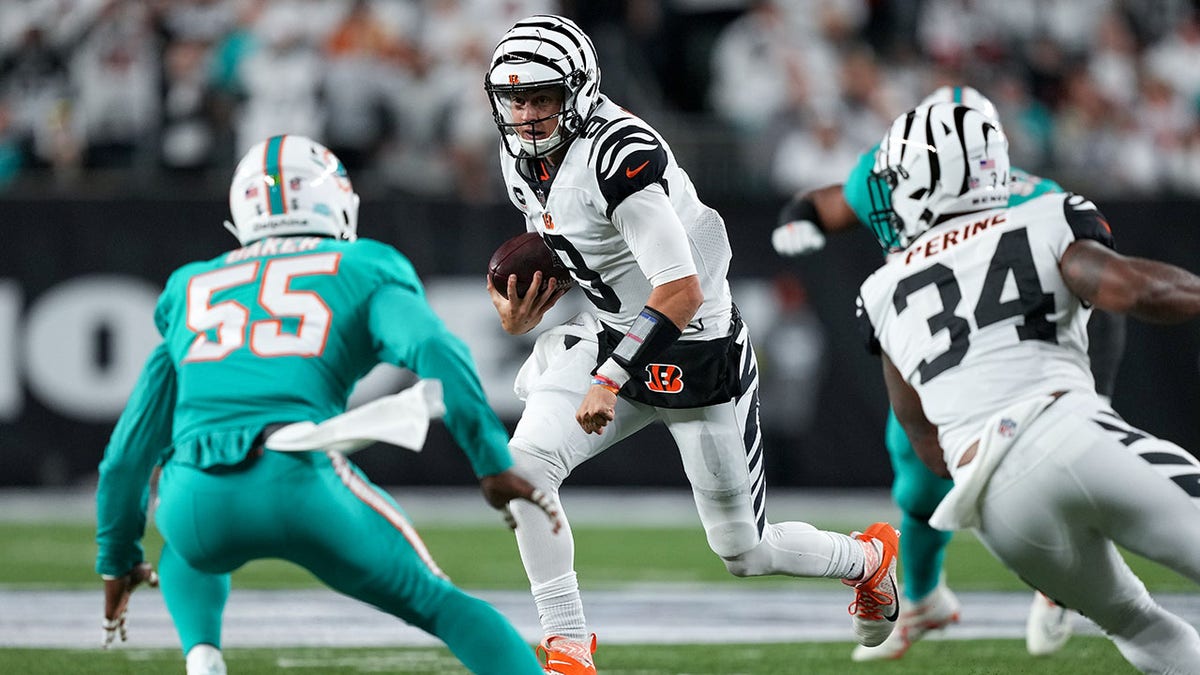 Joe Burrow runs against the Miami Dolphins