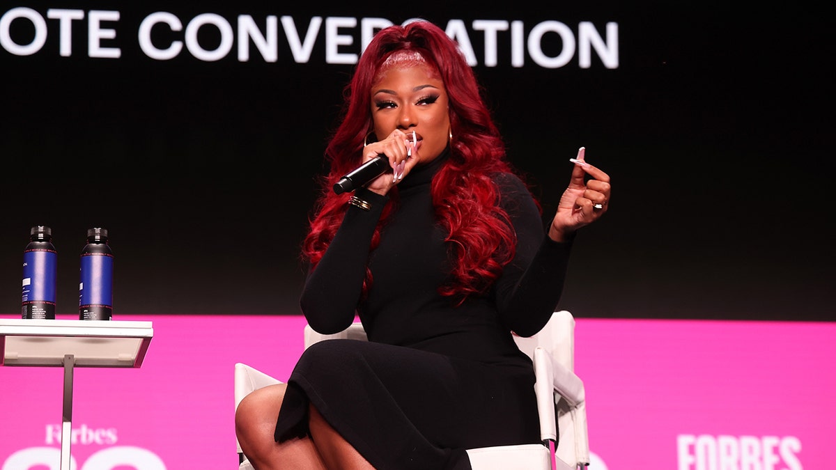 Megan Thee Stallion with a microphone