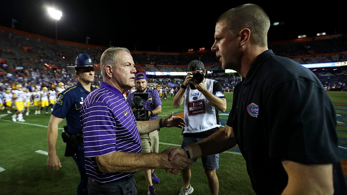 LSU's Brian Kelly shakes hands with Florida head coach