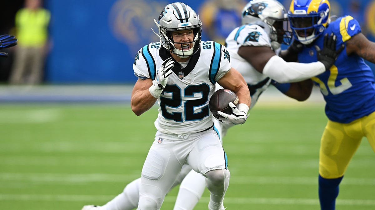 Christian McCaffrey runs against the Rams