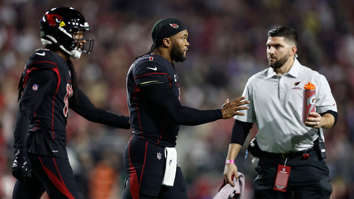 Kyler Murray walks to the sideline against the Saints