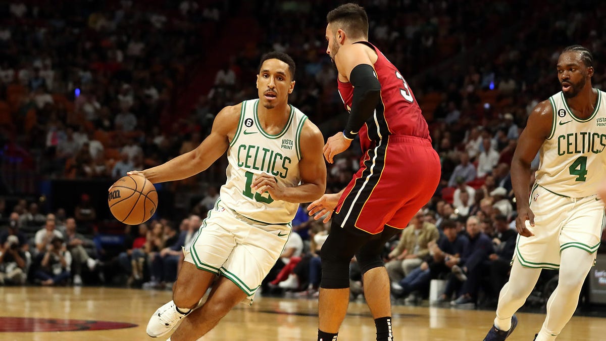 Malcolm Brogdon drives against the Miami Heat