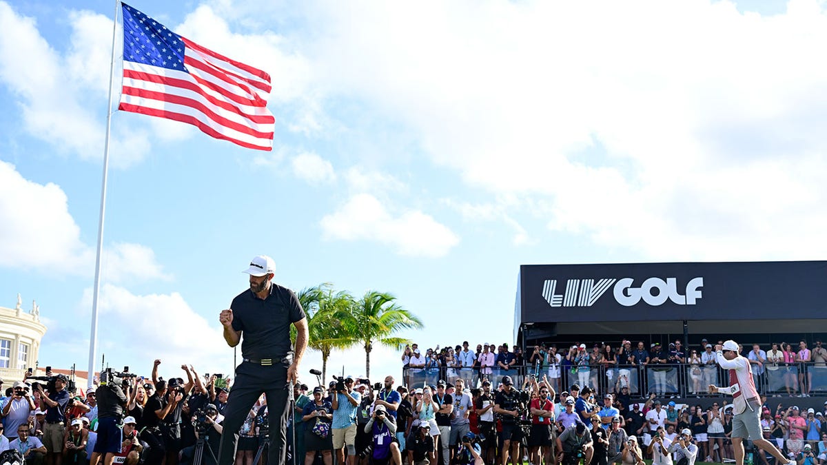 Dustin Johnson celebrates on the 18th hole