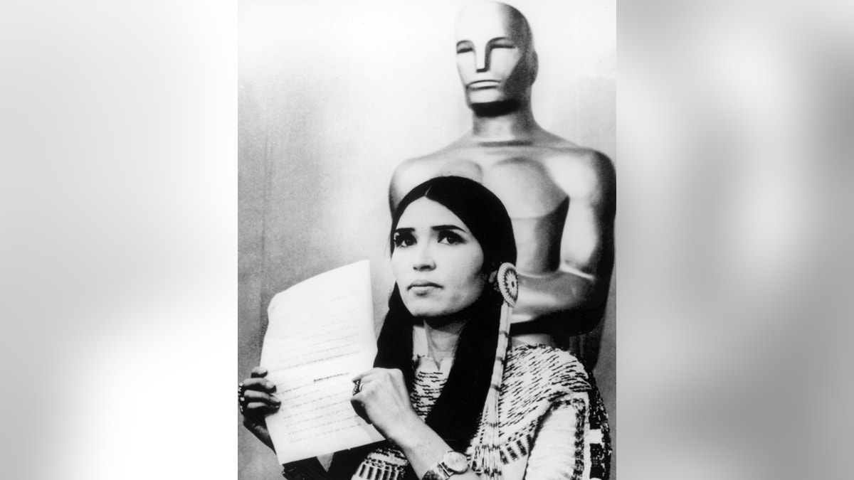 Sacheen Littlefeather holding Brando's statement