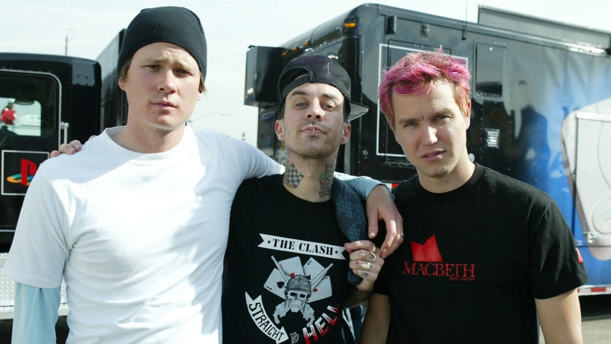 Tom Delonge, Travis Barker and Mark Hoppus at concert