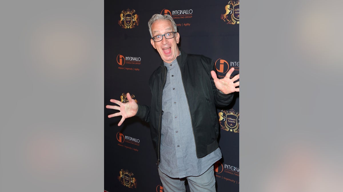 Andy Dick takes a silly photo at an event