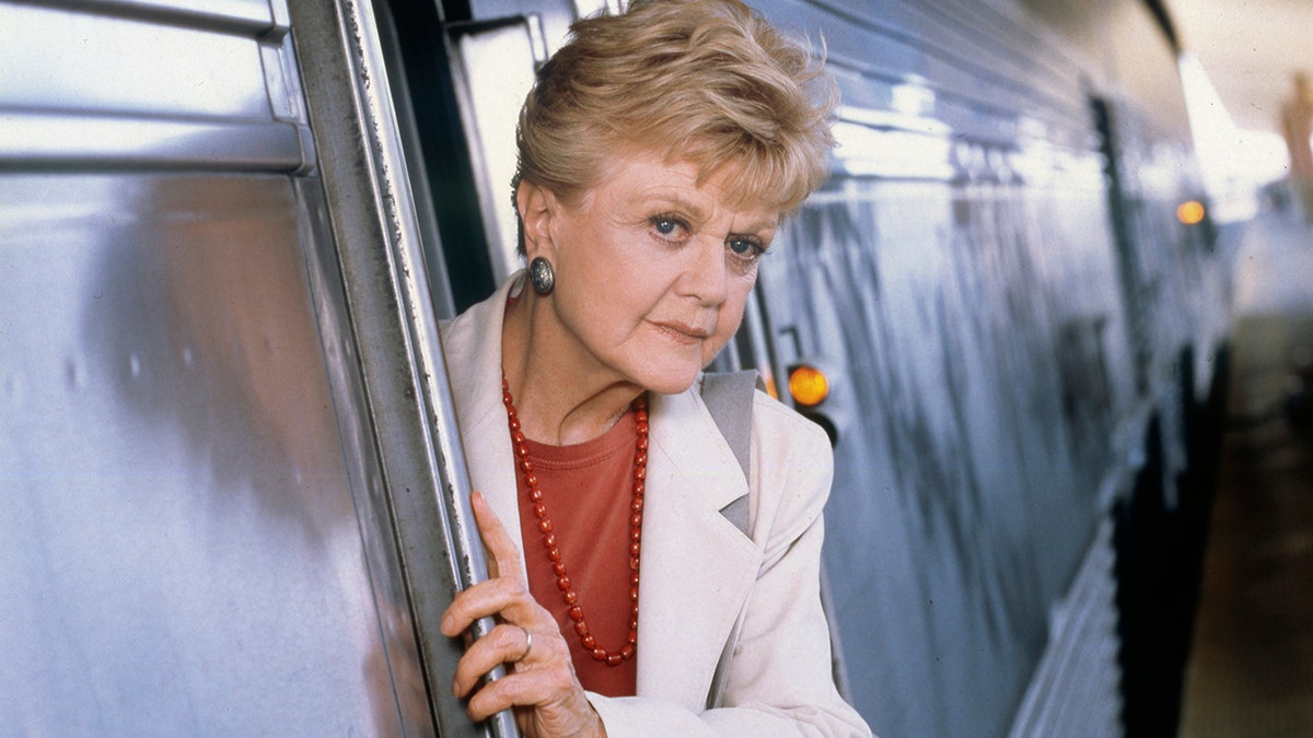 Angela Lansbury wears white blazer and red blouse on Murder She Wrote