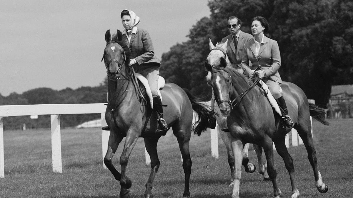 Queen Elizabeth II, Princess Margaret, Countess of Snowdon (1930 - 2002), and Prince Edward, Duke of Kent,