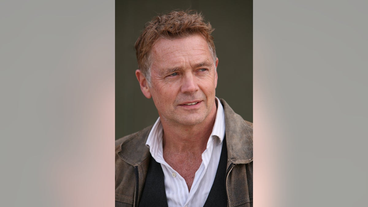 American actor and country singer John Schneider