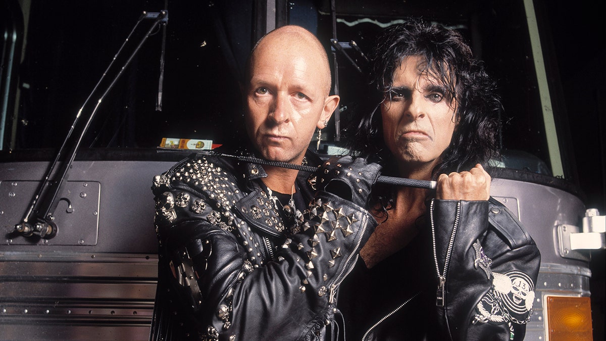 Heavy metal singers Rob Halford (left) and Alice Cooper