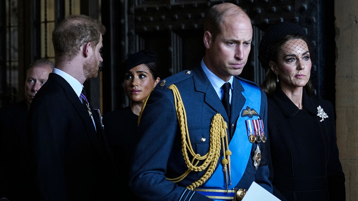Britain's Catherine (R), Princess of Wales, Britain's Prince William (2nd R), Prince of Wales, Britain's Prince Harry (L), Duke of Sussex, and Meghan (2nd L), Duchess of Sussex, leave after paying their respects at Westminster Hall
