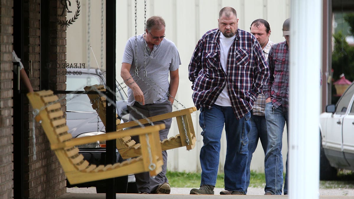 George 'Billy' Wagner, center, and his son's George Wagner IV, in back and Edward "Jake" Wagner, at right, attended the funeral of Gary Rhoden, 38, in Greenup, Kentucky, April 27, 2016.?