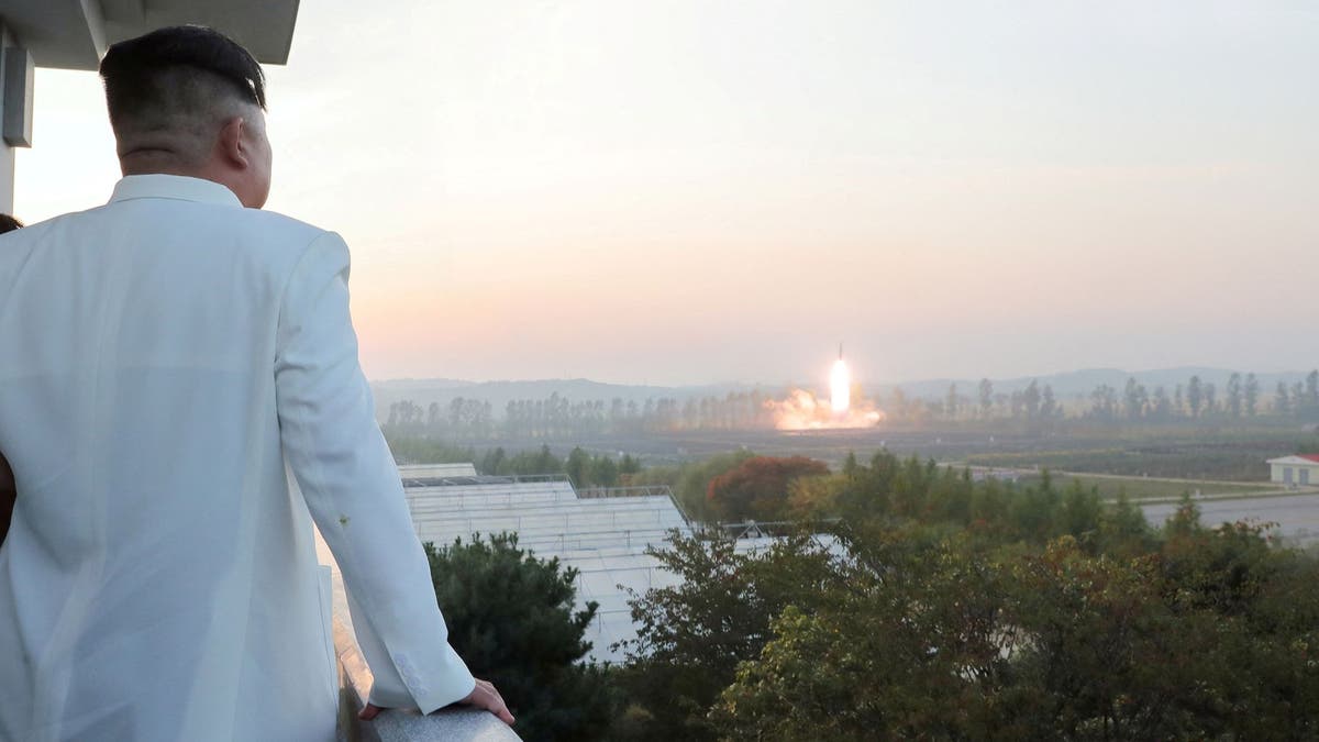 North Korea's leader Kim Jong Un oversees a missile launch