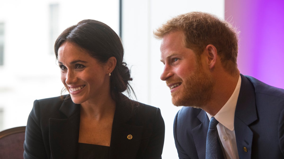 Prince Harry and Meghan Markle smiling together