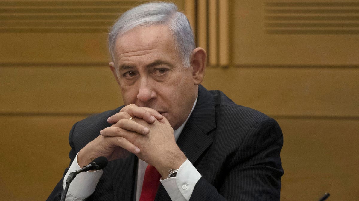 Netanyahu sitting at Knesset