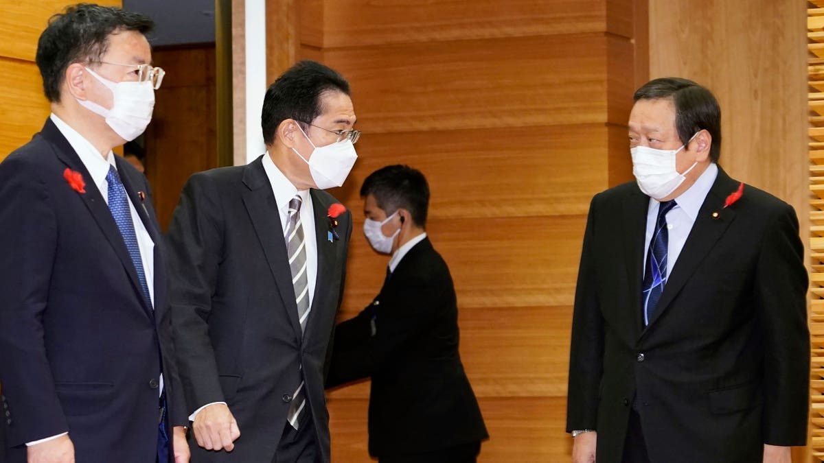 Japanese politicians gathering for a cabinet meeting