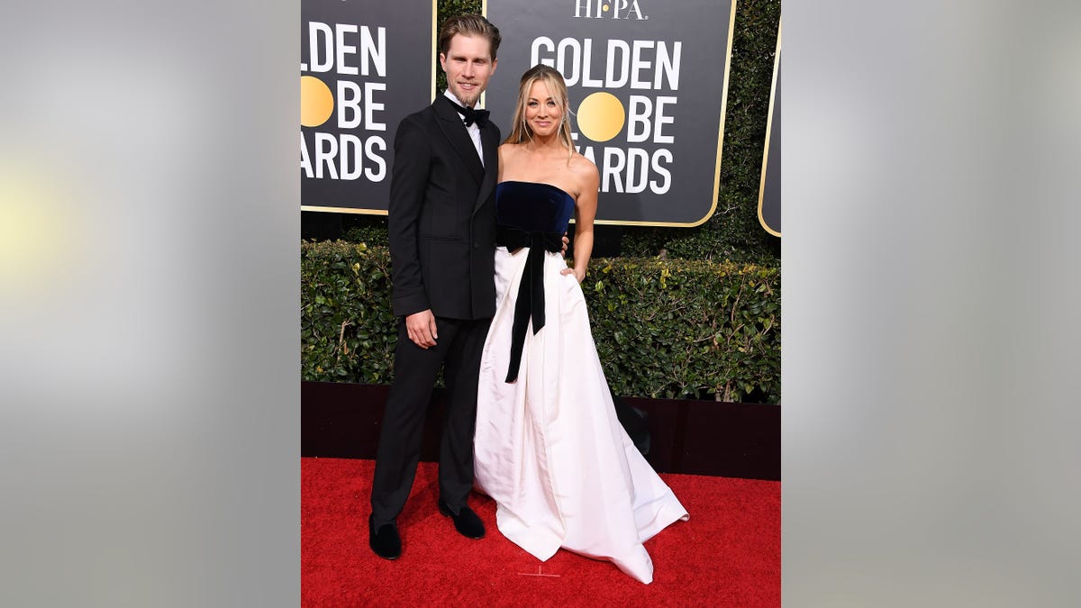 Karl Cook and Kaley Cuoco on red carpet at Golden Globes