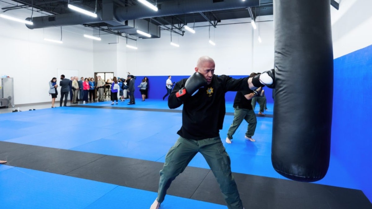 An officer uses a punching bag at the LVMPD reality-based training center