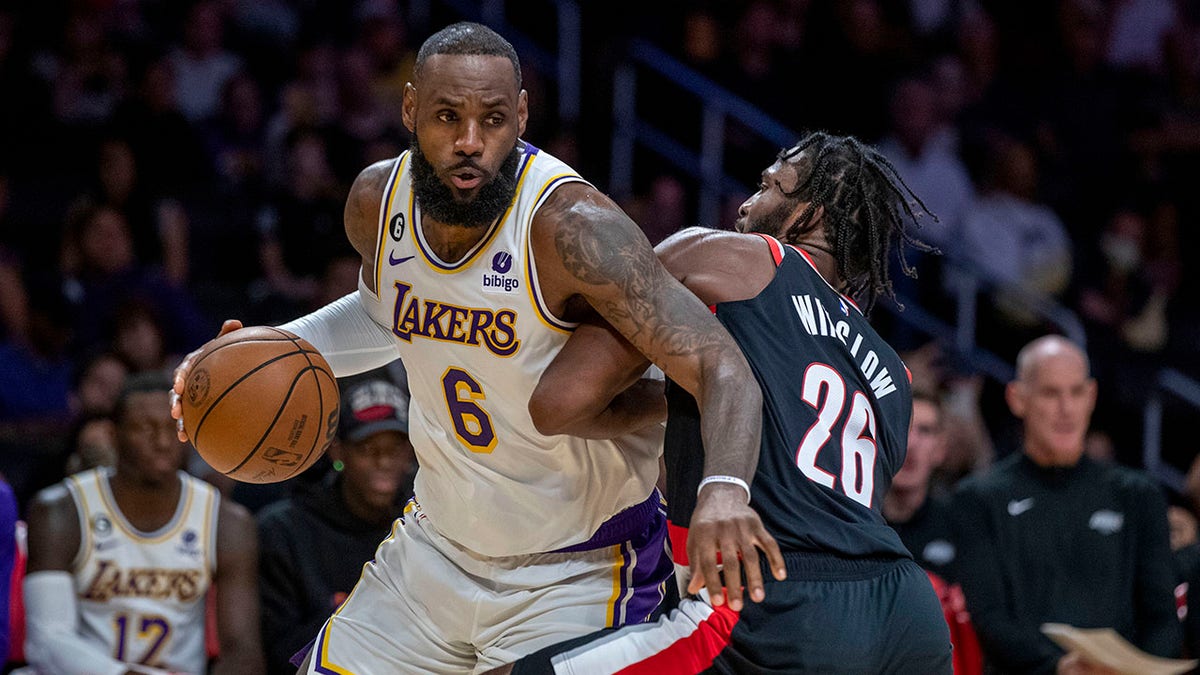 LeBron James drives on Justise Winslow